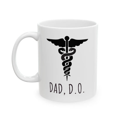 White mug with black caduceus symbol and 'DAD, D.O.' text on a white background